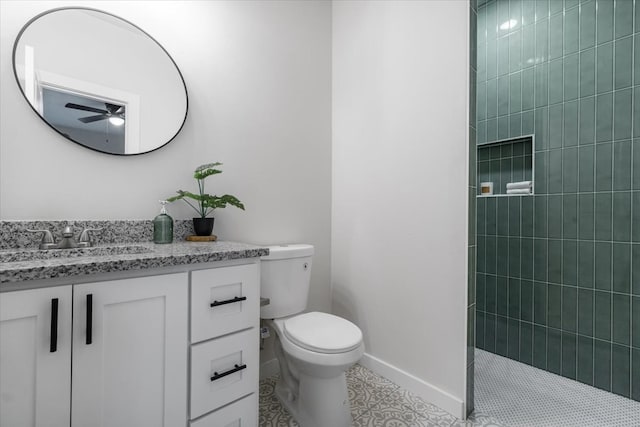 bathroom with vanity, tile patterned flooring, ceiling fan, and toilet