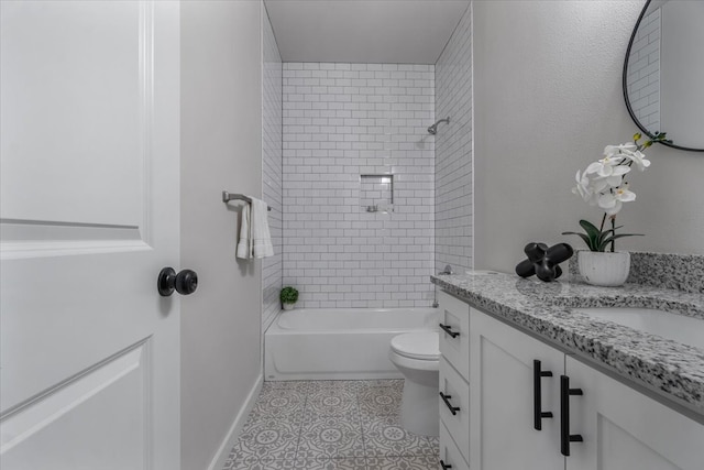 full bathroom with tiled shower / bath combo, vanity, tile patterned flooring, and toilet