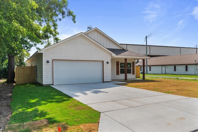 single story home featuring a garage and a front lawn