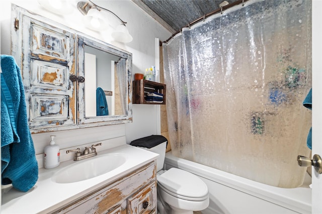 full bathroom featuring toilet, vanity, and shower / tub combo with curtain