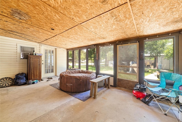 sunroom / solarium featuring a wealth of natural light and wood ceiling