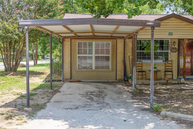 view of outbuilding with a carport