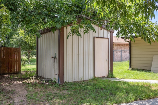 view of outbuilding with a lawn