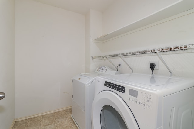 laundry area with separate washer and dryer