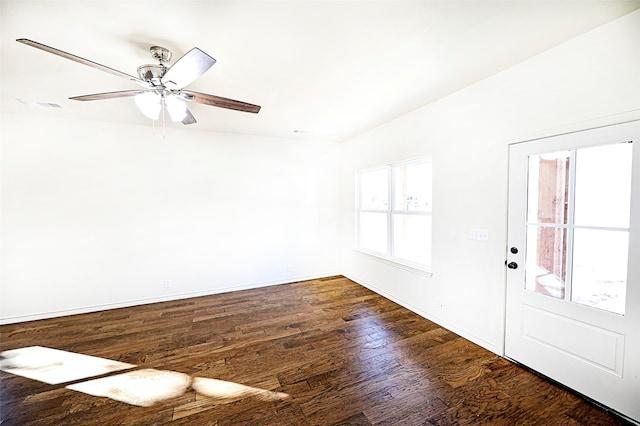 foyer with ceiling fan, dark wood-type flooring, and vaulted ceiling