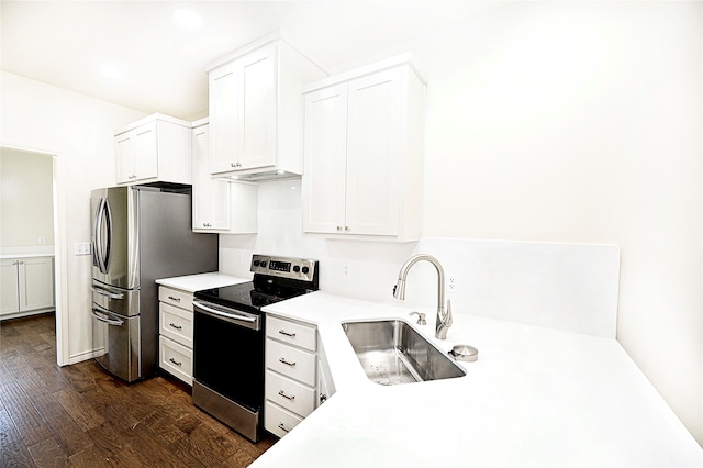 kitchen featuring sink, white cabinets, stainless steel appliances, and dark hardwood / wood-style floors