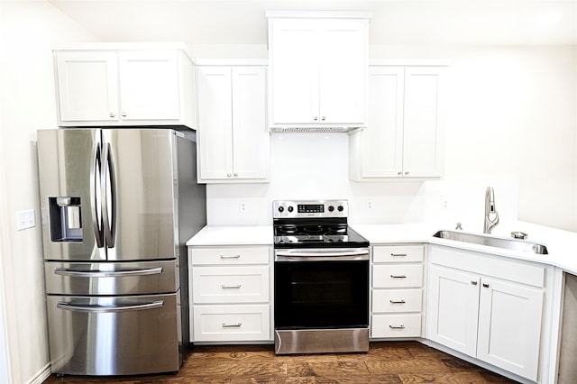 kitchen with white cabinetry, sink, dark hardwood / wood-style floors, and appliances with stainless steel finishes