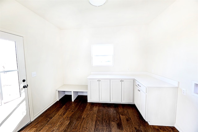 laundry area featuring cabinets, washer hookup, and dark hardwood / wood-style floors