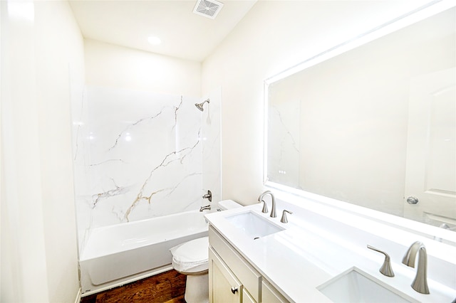 full bathroom with hardwood / wood-style floors, vanity, toilet, and bathing tub / shower combination