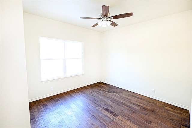 unfurnished room featuring ceiling fan and dark hardwood / wood-style flooring