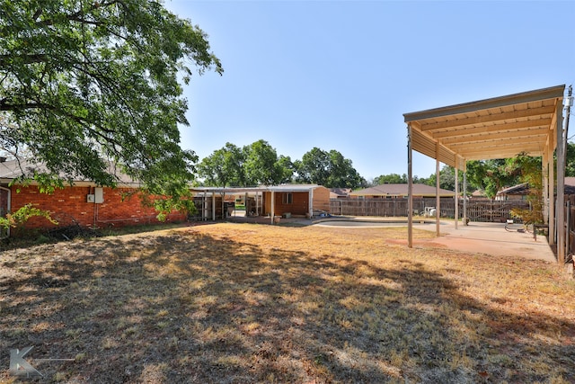 view of yard featuring a carport