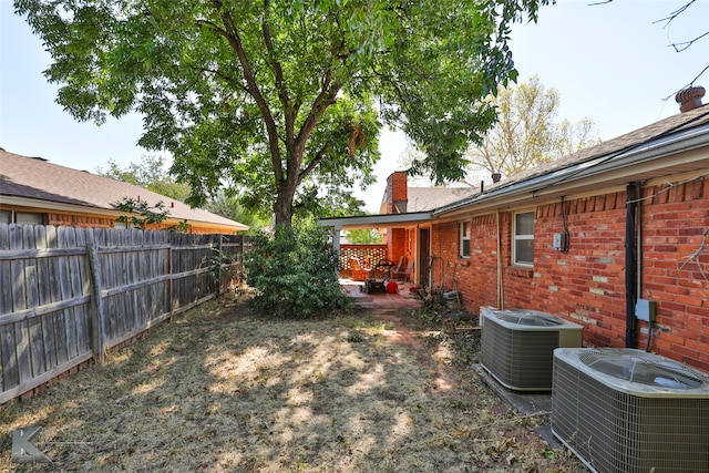 view of yard featuring central air condition unit