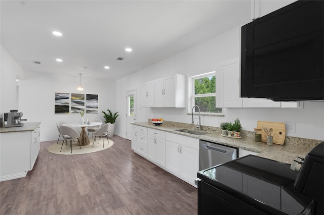 kitchen featuring white cabinets, decorative light fixtures, stainless steel appliances, and sink