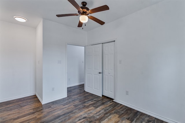 unfurnished bedroom with a closet, ceiling fan, and dark hardwood / wood-style flooring