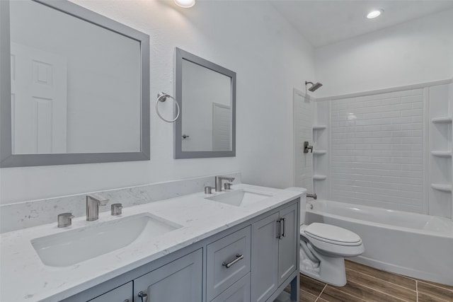 full bathroom featuring vanity, toilet, and tub / shower combination