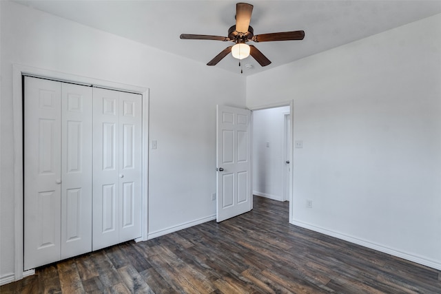 unfurnished bedroom with ceiling fan, a closet, and dark hardwood / wood-style floors