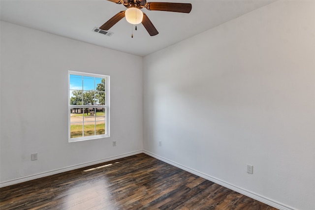 spare room featuring ceiling fan and dark hardwood / wood-style floors