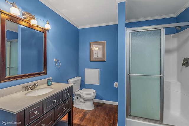 bathroom featuring vanity, hardwood / wood-style flooring, and crown molding