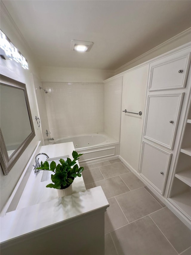 bathroom featuring tile patterned flooring and tiled shower / bath