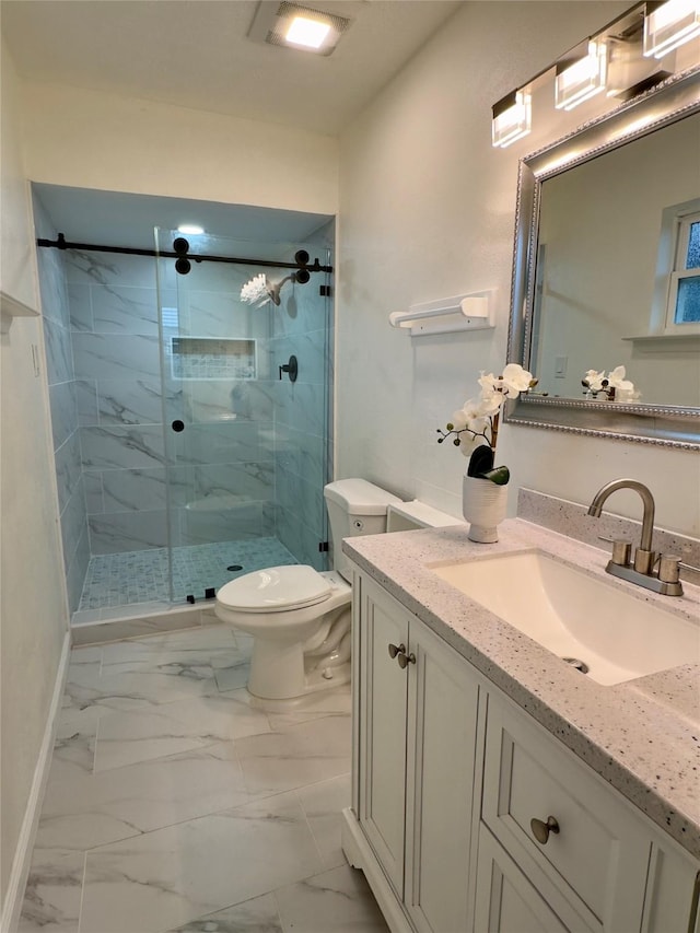 bathroom featuring vanity, toilet, and a shower with shower door