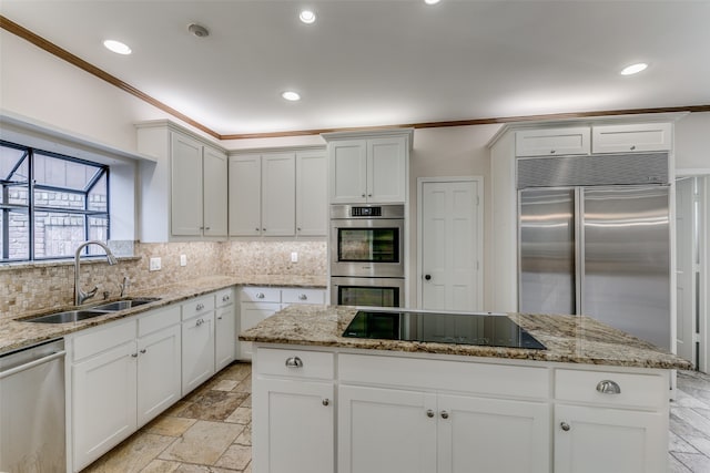 kitchen with light tile patterned floors, tasteful backsplash, appliances with stainless steel finishes, and sink