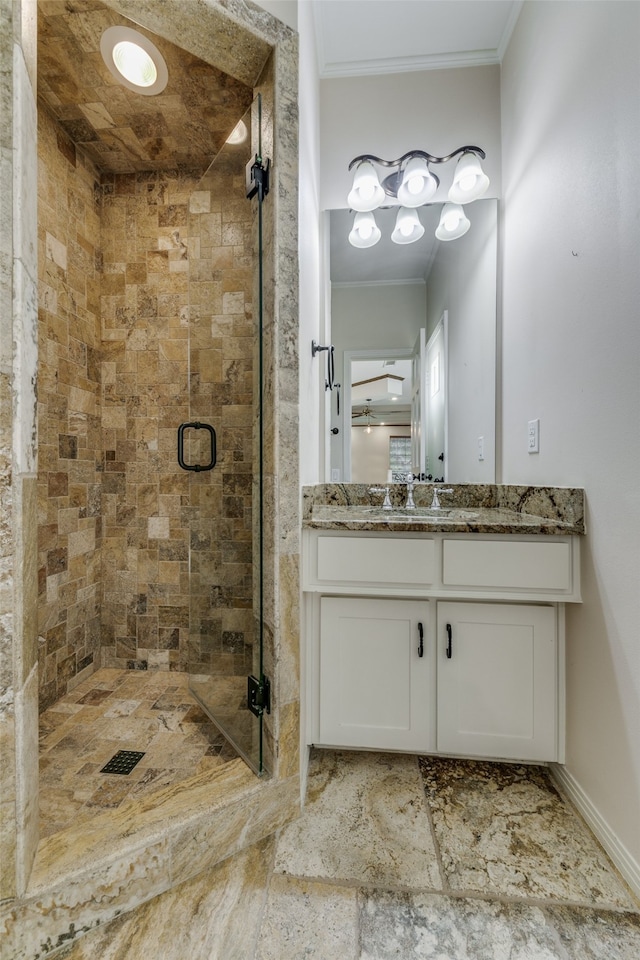 bathroom with tile patterned flooring, an enclosed shower, vanity, and ornamental molding