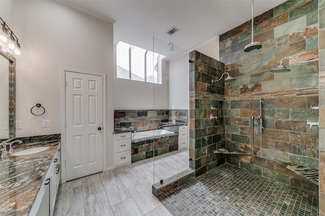 bathroom featuring separate shower and tub, tile patterned floors, and vanity