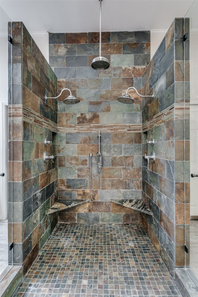 bathroom with a tile shower