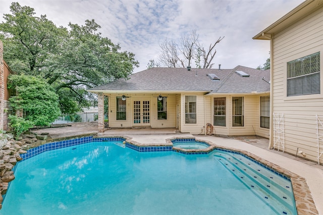 view of swimming pool with a patio, an in ground hot tub, and ceiling fan