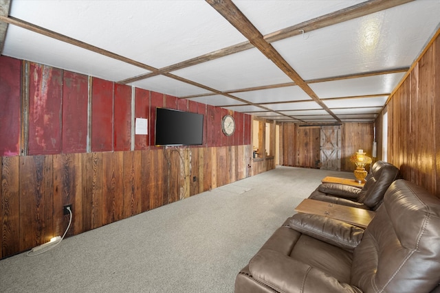 carpeted cinema room with wood walls and coffered ceiling