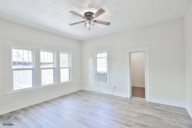 empty room with light hardwood / wood-style flooring and ceiling fan