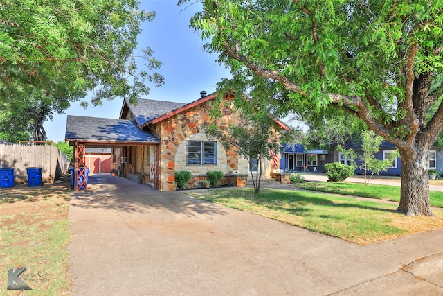 view of front of property featuring a garage and a front lawn