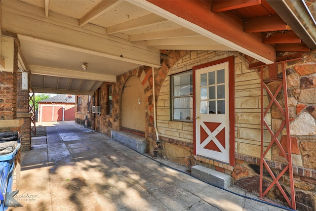 view of patio featuring a shed