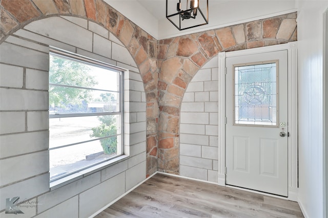 doorway to outside with light hardwood / wood-style floors