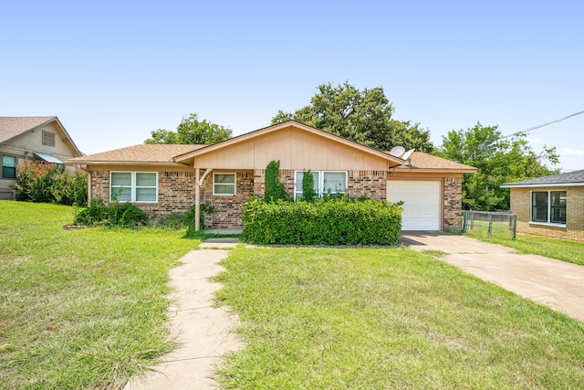 single story home featuring a garage and a front lawn