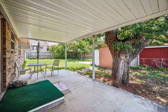 view of patio with a shed