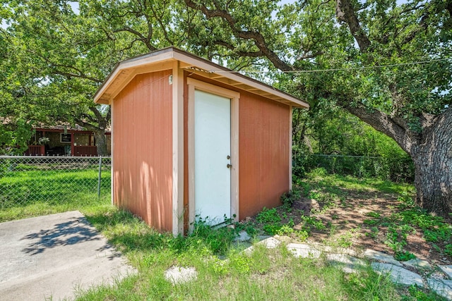 view of outdoor structure featuring a lawn