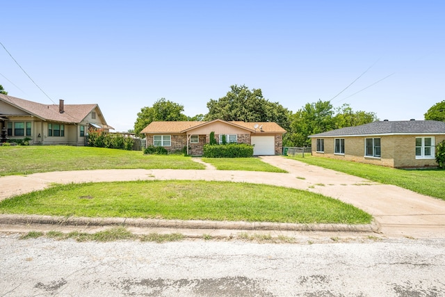 ranch-style home featuring a garage and a front yard