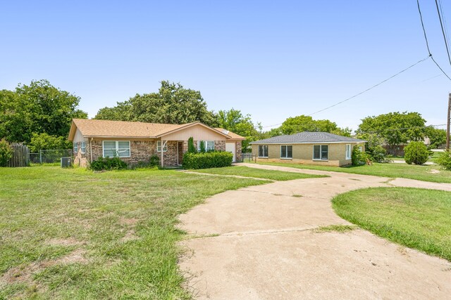 ranch-style home with a front yard