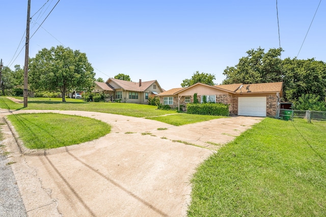 single story home featuring a garage and a front lawn