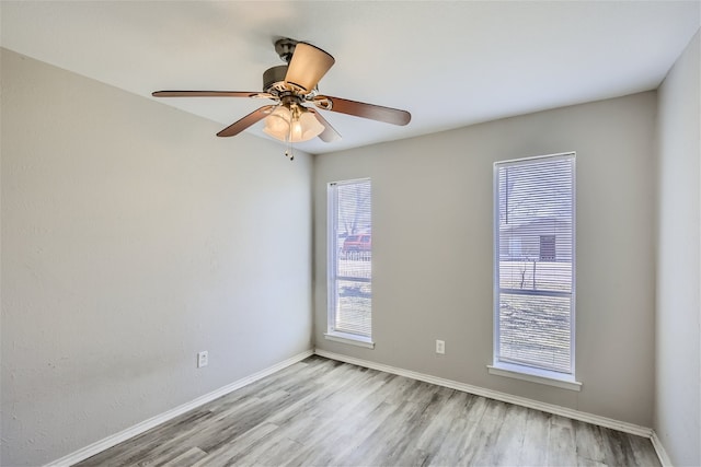 spare room with ceiling fan and light hardwood / wood-style floors