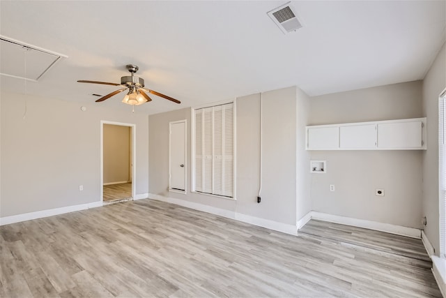 empty room featuring ceiling fan and light wood-type flooring