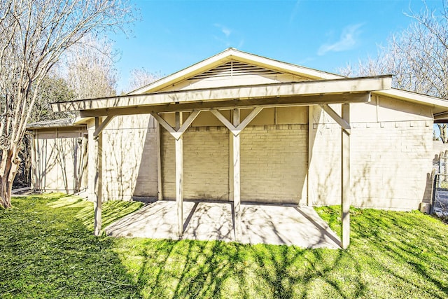 view of outbuilding featuring a yard