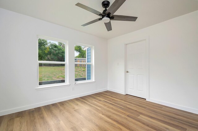 unfurnished room with light hardwood / wood-style floors and ceiling fan