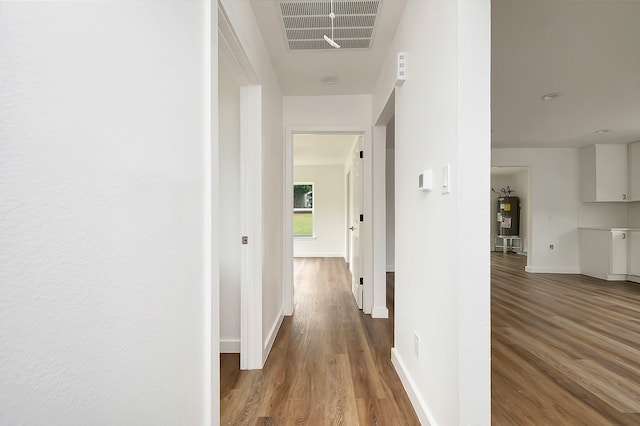 hallway with wood-type flooring