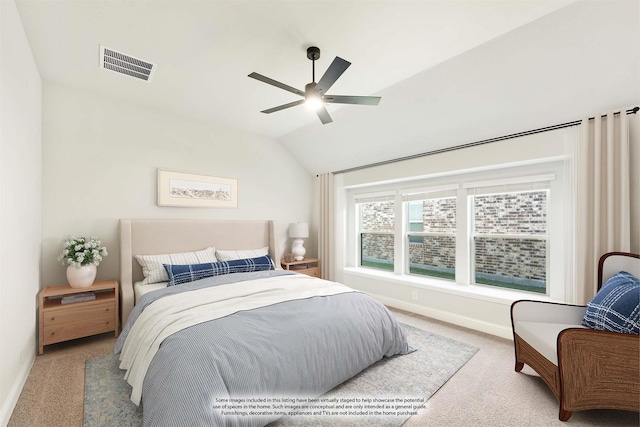 bedroom featuring lofted ceiling, light colored carpet, and ceiling fan