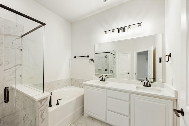 bathroom with shower with separate bathtub and vanity