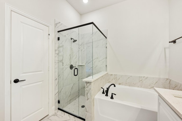 bathroom with vanity and independent shower and bath