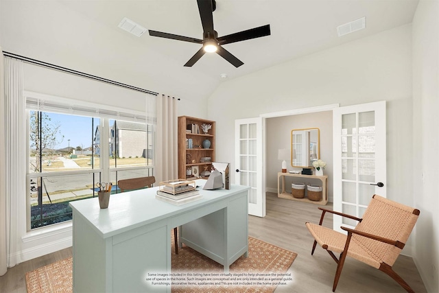 home office featuring french doors, light hardwood / wood-style floors, ceiling fan, and lofted ceiling