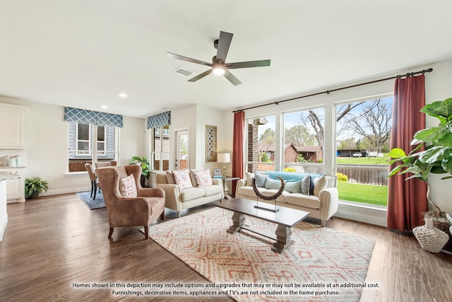 living room featuring ceiling fan and hardwood / wood-style flooring